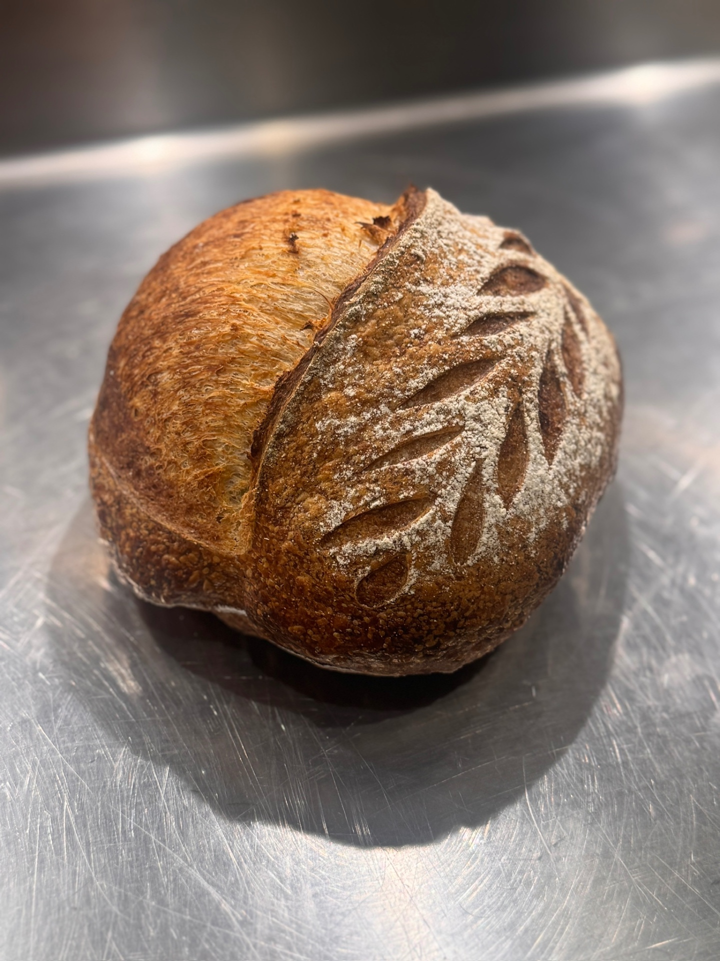 Hand-scored sourdough loaf